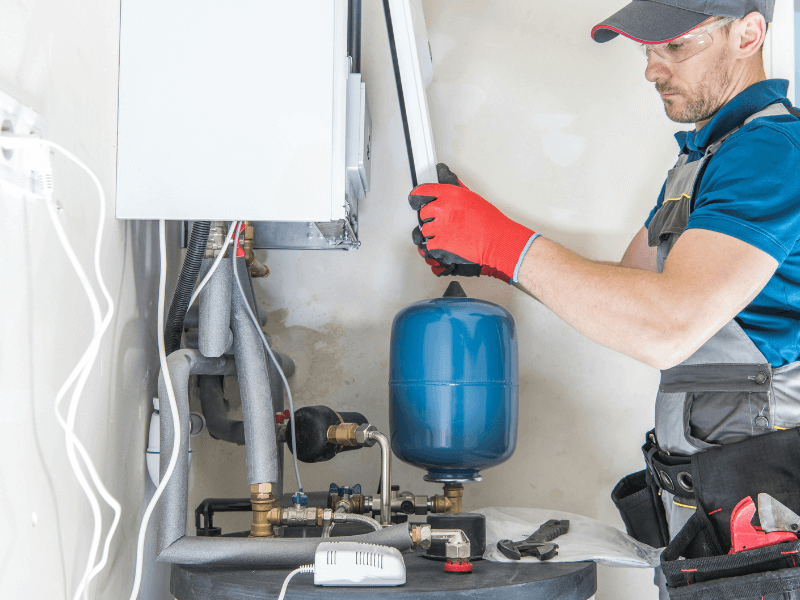 Performing maintenance or installation work on a boiler system.
